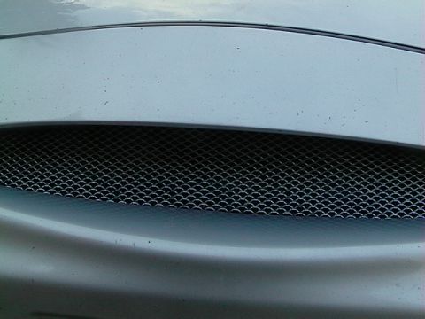 1999 Ford Taurus - Close-up of the front grille on a 1999 Ford Taurus.