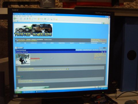 1988 Ford Bronco - A computer monitor displays the "Twisted Wheelers" website, images of off-road vehicles.