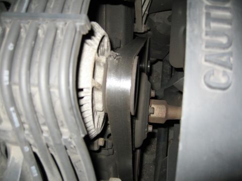 1992 Ford Crown Victoria - The alternator and drive belt are visible in this engine bay shot, with some spark plug wires on the side.