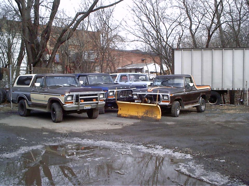 1979 Ford Bronco with a yellow snow plow attached to the front