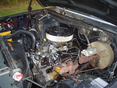 1981 Ford Bronco - Close-up view of the engine compartment, showing various mechanical components and wiring.