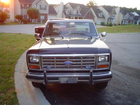1981 Ford Bronco - A Ford F-Series truck is parked in a driveway with houses in the background.