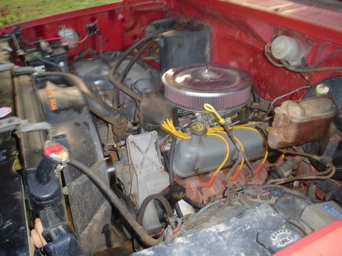 1981 Ford Bronco - Close-up view of a vehicle's engine bay, showing various components and wiring.