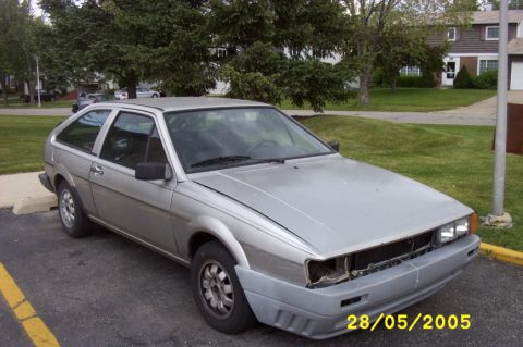 1983 Volkswagen Scirocco - A silver 1983 Volkswagen Scirocco is shown from the front three-quarter view, with its grille and front bumper in disrepair.