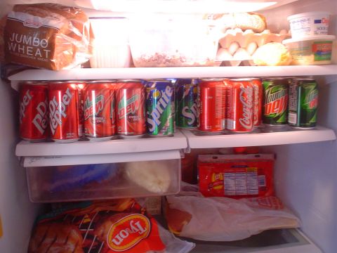 1993 Ford Taurus - Contents of a refrigerator include bread, eggs, various soda cans, and packaged meat products.