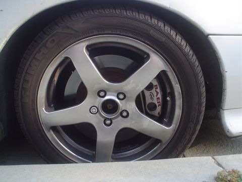 1993 Ford Taurus - Custom Baer brake caliper visible behind the aftermarket wheel on this vehicle.