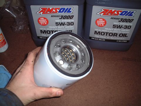 2000 Ford Excursion - AMSOIL Series 3000 5W-30 motor oil bottles and a new oil filter are shown.
