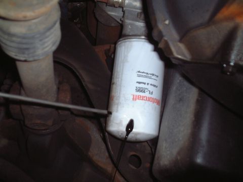 2000 Ford Excursion - A Motorcraft FL-1995 oil filter is shown with oil dripping from its seal.