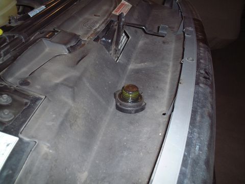 2000 Ford Excursion - The oil cap is visible under the hood of a 2000 Ford Excursion.