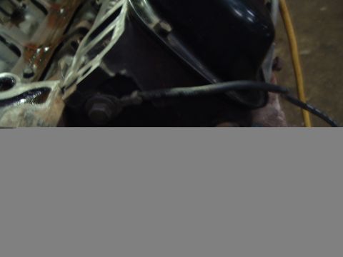 1989 Ford Crown Victoria LTD - Close-up view of engine components, including hoses and wiring, with visible signs of wear and tear.