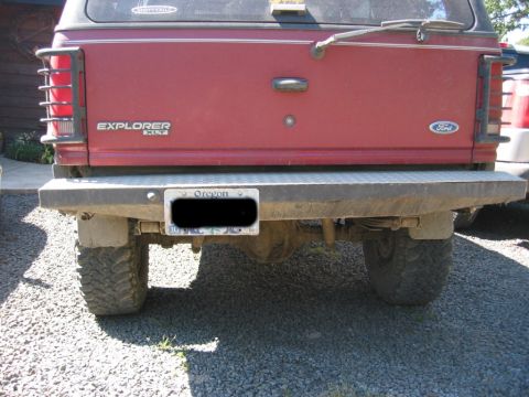 1991 Ford Explorer - Rear view of a red 1991 Ford Explorer XLT, showing the tailgate, bumper, and Oregon license plate.