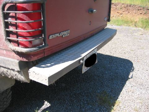 1991 Ford Explorer - Rear view of a 1991 Ford Explorer showing its taillight and aftermarket step bumper.