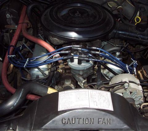 1985 Ford Crown Victoria LTD - Close-up view of the engine bay of a 1985 Ford Crown Victoria LTD, highlighting key components and wiring.