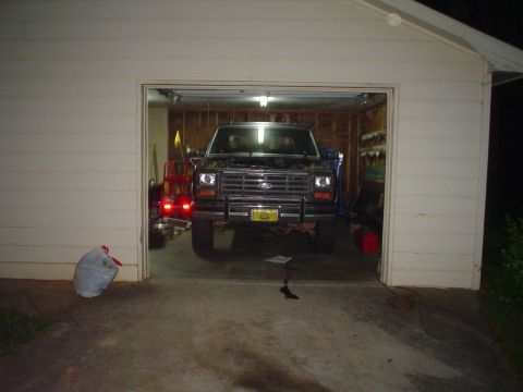 1981 Ford Bronco - A 1981 Ford Bronco is parked inside a garage with its hood up.