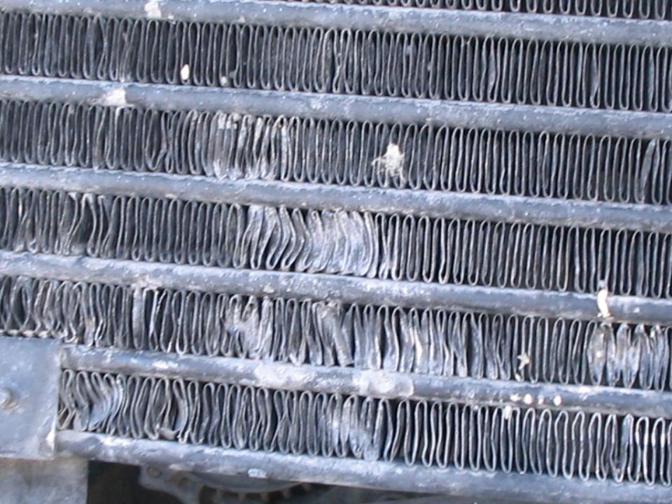Close-up of bent and damaged radiator fins