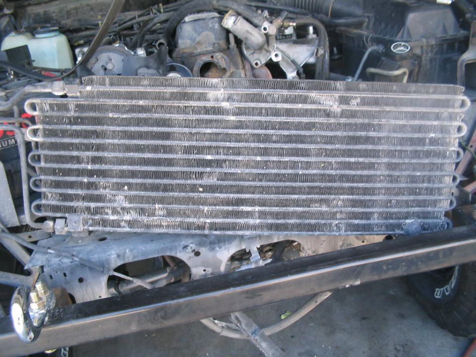 Transmission cooler with engine components visible behind it