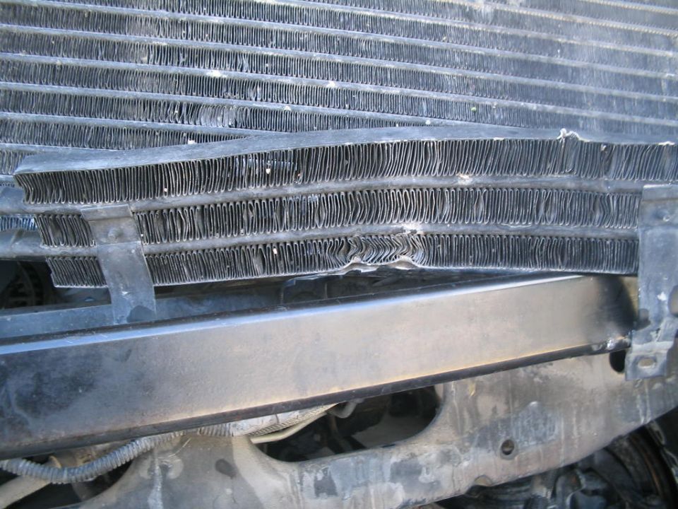 Damaged radiator fins with bent tubes
