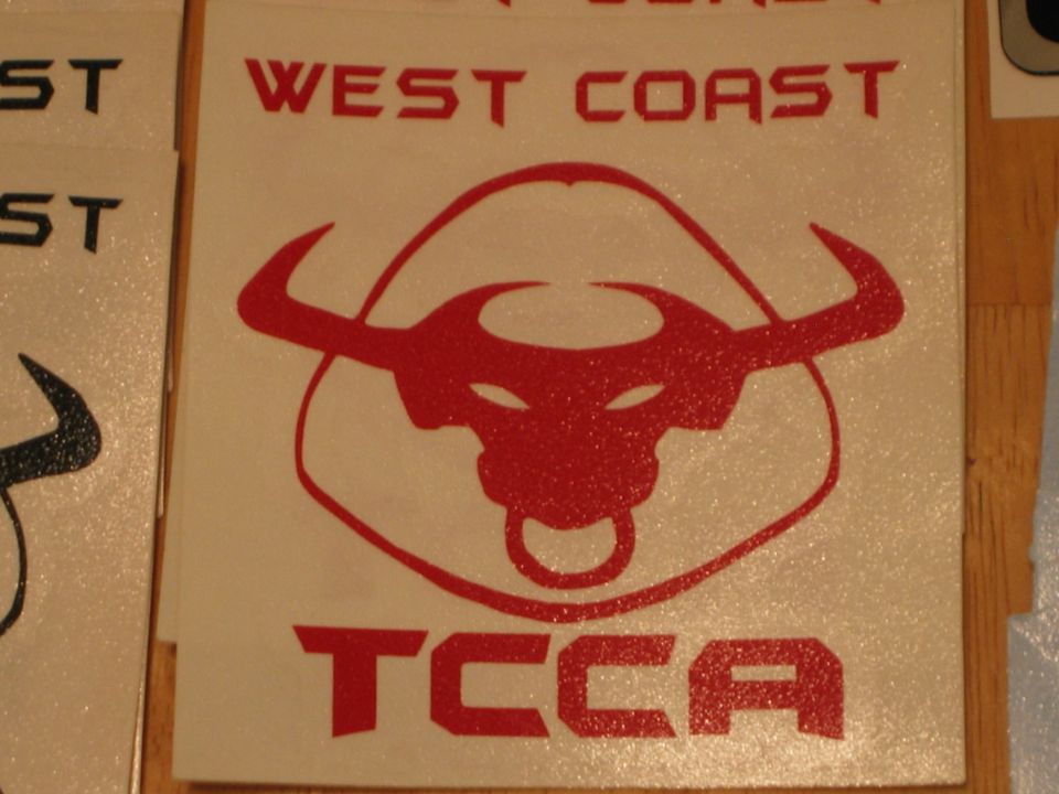 Red decal with text 'WEST COAST' above a bull's head logo and 'TCCA' below