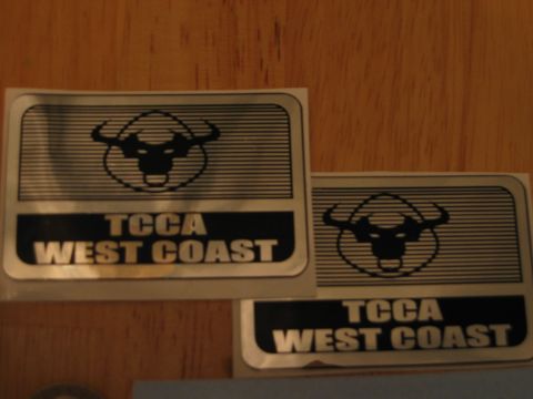 2002 Ford Taurus - Two stickers with a bull logo and the text TCCA West Coast are shown.