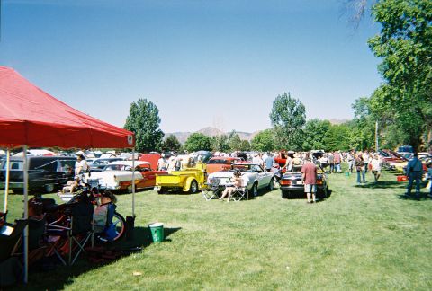 1972 Ford Ranchero - A sunny day at a car show with many vehicles and attendees enjoying the event.