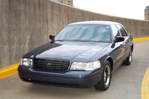 1998 Ford Crown Victoria - Front 3/4 view of a 1998 Ford Crown Victoria parked outdoors.