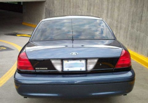 1998 Ford Crown Victoria - Rear view of a 1998 Ford Crown Victoria, parked outdoors.