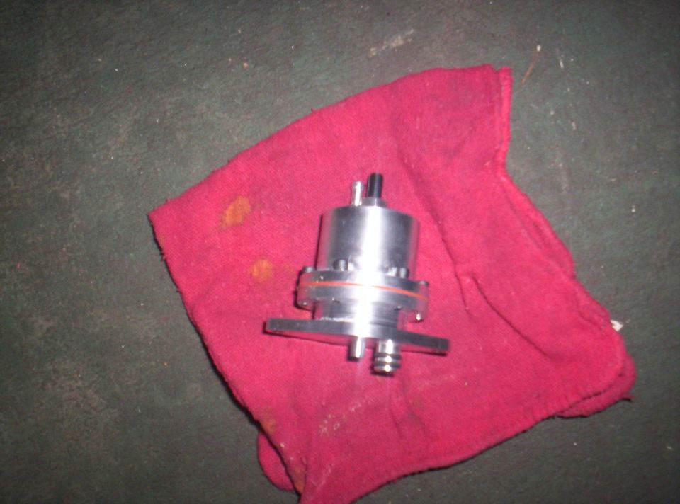 Metal fuel pump sitting on a red rag