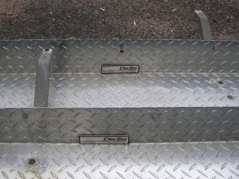 1995 Ford Bronco - Close-up view of diamond plate metal with brand emblems and a website watermark.