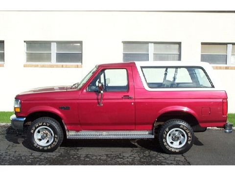 1995 Ford Bronco - This 1995 Ford Bronco is shown from the side, its distinctive red body and white removable top.
