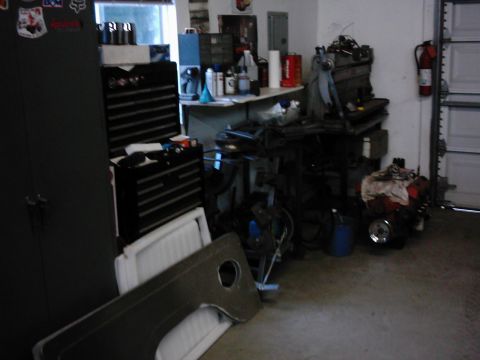 1978 Ford Bronco - Garage scene with various tools, engine components, and storage cabinets visible.