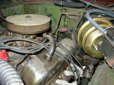 1995 Ford Bronco - Close-up view of the engine compartment, showing various mechanical components and wiring.