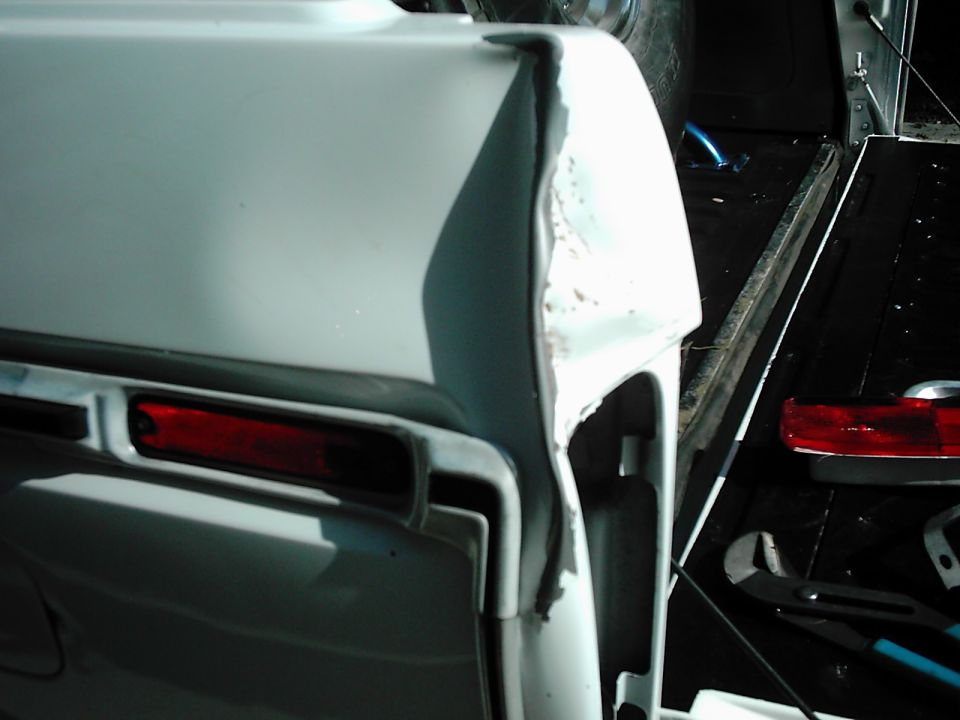 1978 Ford Bronco rear quarter panel with visible damage near taillight housing