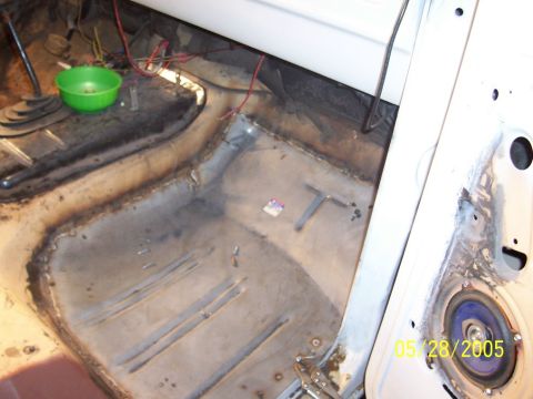 1979 Ford Bronco - Vehicle interior floor with exposed metal and wiring, possibly during restoration or repair work.