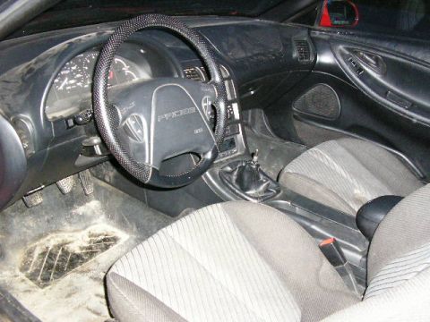 1994 Ford Probe - Interior view of a 1994 Ford Probe, showing the dashboard, steering wheel, and seats.