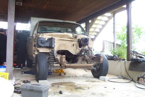 1985 Ford F-150 - This pickup truck is undergoing repairs or modifications, with its front end disassembled.