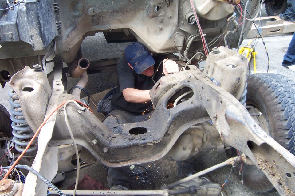 removing the mounts for the motor... need to add them to the cross member on the new truck as the 6 cyl was mounted in the middle of the crossmember...