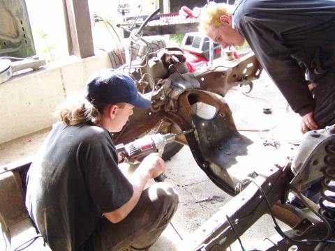 1985 Ford F-150 - Drilling out the old rivets to put in the motor mounts...