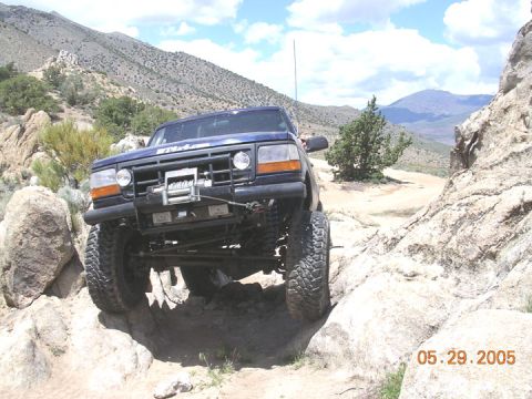 1994 Ford Bronco - This 1994 Ford Bronco navigates a rocky trail, demonstrating its off-road capabilities with a front-mounted winch.