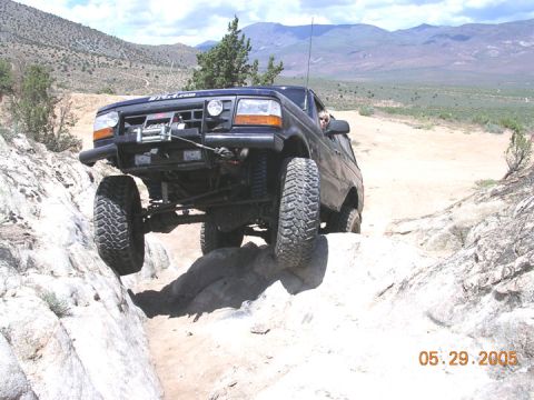 1994 Ford Bronco - This 1994 Ford Bronco tackles a challenging off-road course with one wheel lifted.