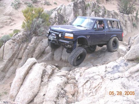 1994 Ford Bronco - This 1994 Ford Bronco is shown off-roading over a challenging rocky landscape.