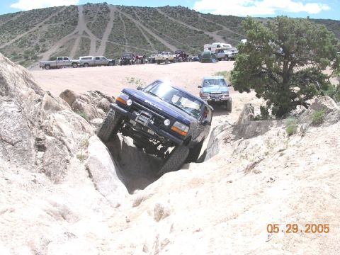 1994 Ford Bronco - Off-roading in a 1994 Ford Bronco, navigating a challenging rocky terrain.