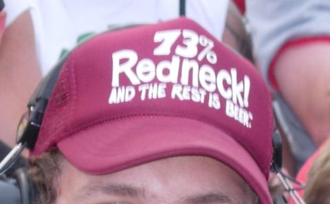 1995 Ford Bronco - A person is wearing a hat with a humorous slogan about being a redneck and drinking beer.