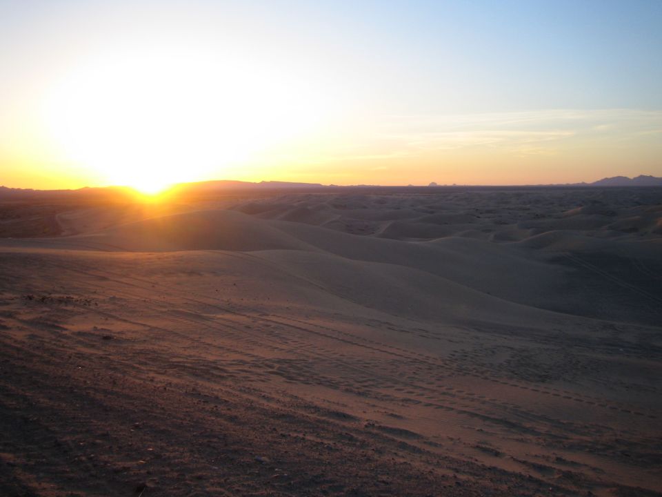 Desert dunes landscape with sunset