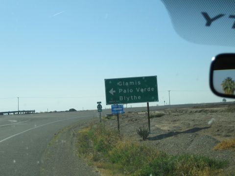 1968 Ford Mustang - Roadside signs indicate directions to Glamis, Palo Verde, and Blythe under a clear blue sky.