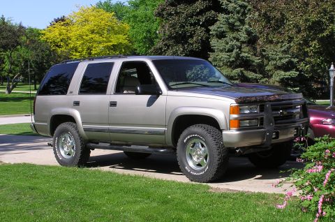 2000 Chevrolet Tahoe - This silver SUV, likely from the mid-1990s, is shown in a 3/4 front view with a prominent brush guard.