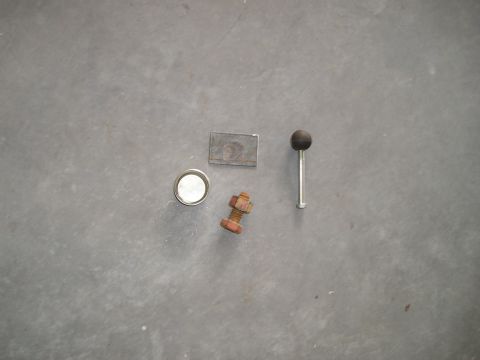 1996 Ford Bronco - Various automotive parts laid out on a gray surface.