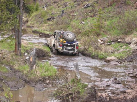 1985 Ford Bronco - Greg going through a bog on the other end of the rock section.. It's deep but it's got a rock bottom, so it's pretty simple. Just gotta wat…