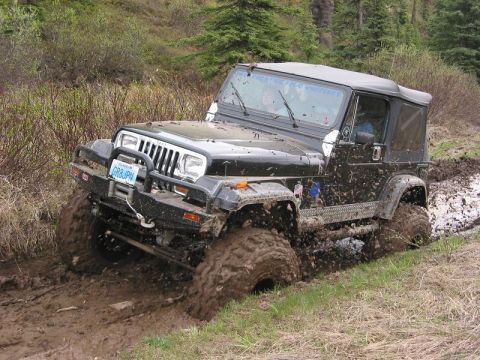 1985 Ford Bronco - Rick trying a mud hole. It's not deep but really gooie, and sticks to your tires really good!