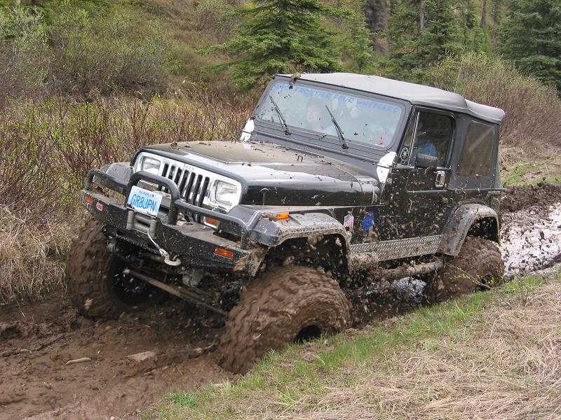 Rick trying a mud hole. It's not deep but really gooie, and sticks to your tires really good!