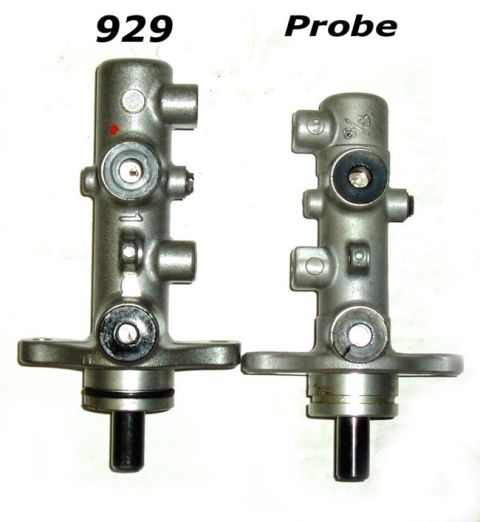 1995 Ford Probe - Comparison of two brake master cylinders, one labeled '929' and the other 'Probe', against a white background.